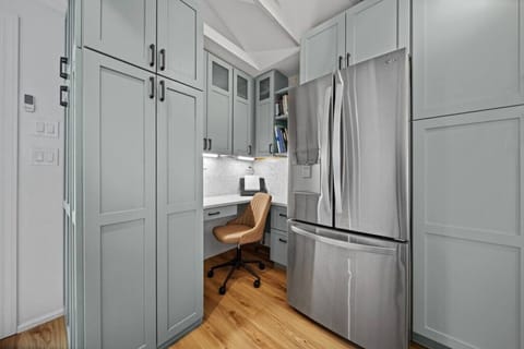 Functional and convenient workspace seamlessly integrated into the open-concept kitchen, perfect for catching up on work or planning your day.