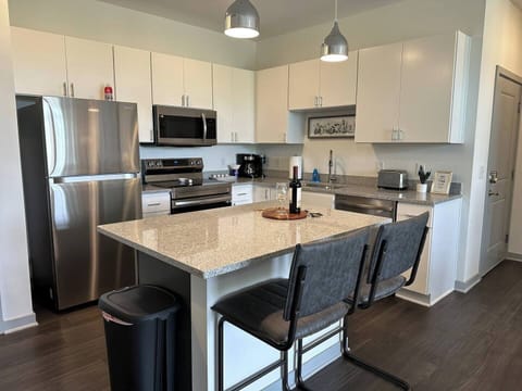 Spacious kitchen with brand new appliances and lots of counter and cabinet space, generously stocked with kitchenware!