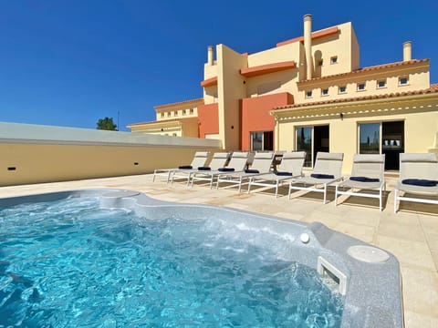 Outdoor pool, a heated pool, sun loungers