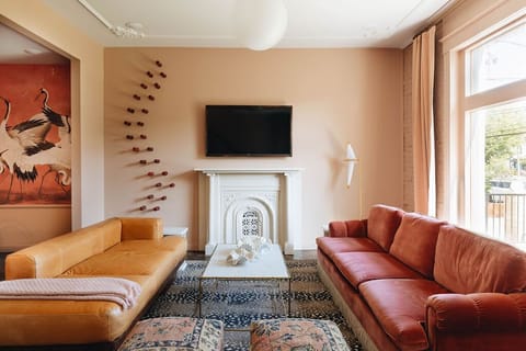 Living room modern minimalist meets vintage maximalist
