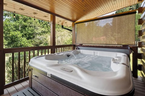 5 person hot tub with roller shades on both sides of the deck for extra privacy