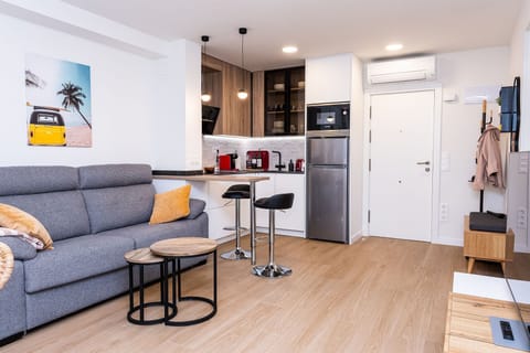 Living room with bar table and kitchen