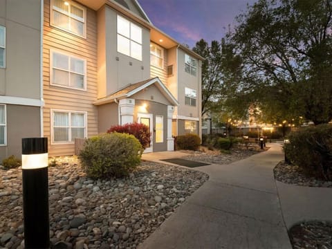 Arrive to a warmly lit exterior and welcoming pathways.