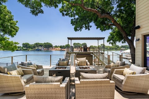 Enjoy outdoor lounging and dining overlooking the Colorado arm of Lake LBJ!