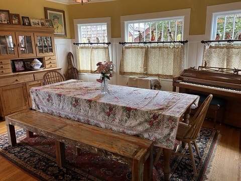 Large dining room with farm table perfect for meals, play and socializing