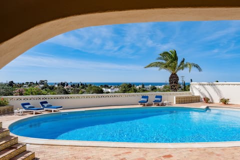 Outdoor pool, a heated pool, sun loungers