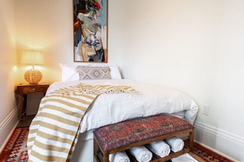 Luxurious bedroom featuring a Queen bed with bohemian elegance, promising restful nights after exploring Stratford’s historical downtown and Avon River. Close to the Stratford Festival, it's a haven of comfort and style