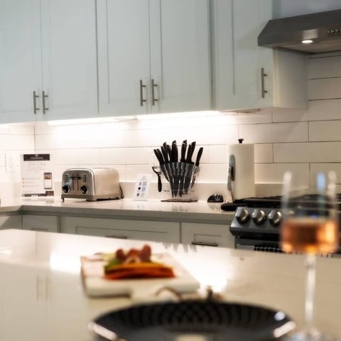 A fully functional kitchen —equipped with modern appliances, stocked cabinets, cookware, utensils, and a coffee maker. Perfect for home-cooked meals, morning brews, and effortless entertaining
