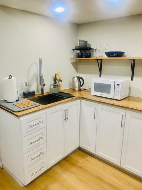 Fridge, microwave, electric kettle, cookware/dishes/utensils