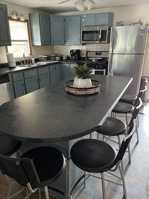 Large eat-in kitchen opens to living area.