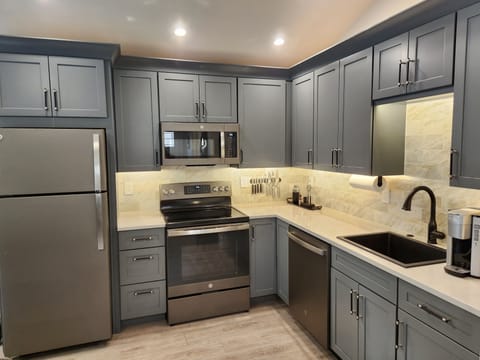 Crate & Barrel dishes, pizza sheet, utensils, food storage, olive oil, sweetener