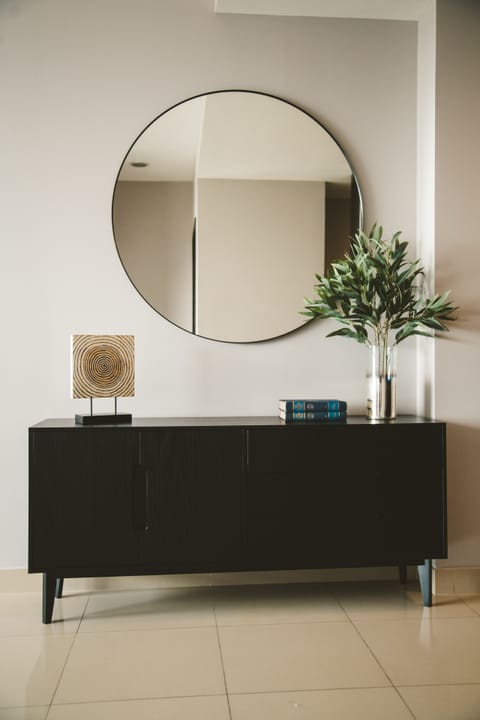 The apartment exudes a captivating ambiance with its cozy and elegant decor.