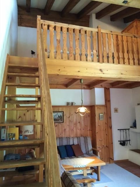 Living room with stairs to the gallery