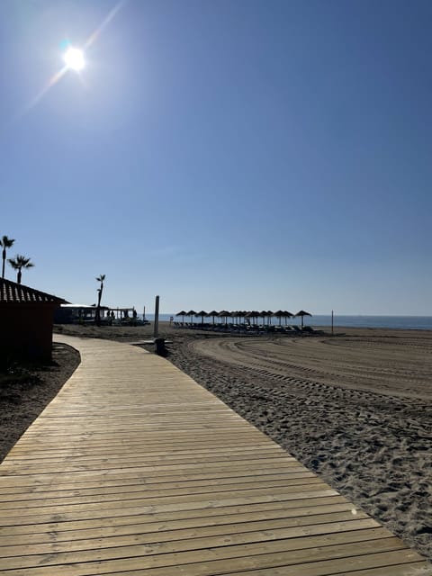 On the beach, sun loungers, beach towels