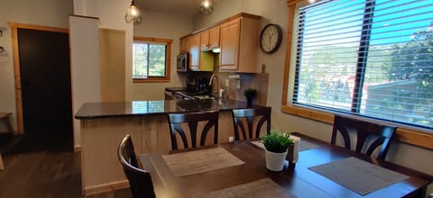 Dining table fits 6 and has a leaf for expansion. Folding chairs available