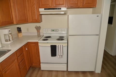 Fridge, stovetop, cookware/dishes/utensils, dining tables