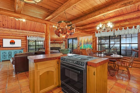 Range with oven in the island of the kitchen.