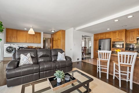 Living room with kitchen & laundry area