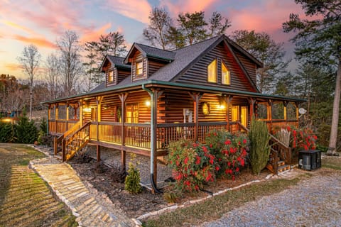 Nestled in a peaceful neighborhood, just minutes from all the attractions. With 5 spacious bedrooms and 4 bathrooms, this nearly 3,000 sq ft cabin comfortably sleeps 14 guests, making it the p