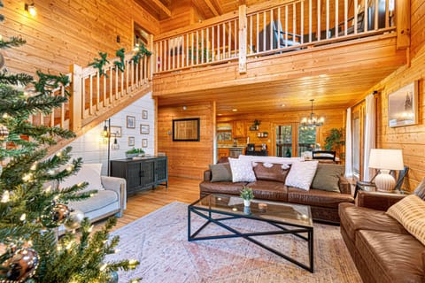 Step into this spacious living room, where modern décor meets ultimate comfort! Perfect for relaxation, this space is ready to welcome you and your loved ones for a movie night, or simply soaking in the ambiance of your serene getaway!