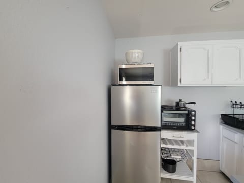 Fridge, microwave, coffee/tea maker, toaster