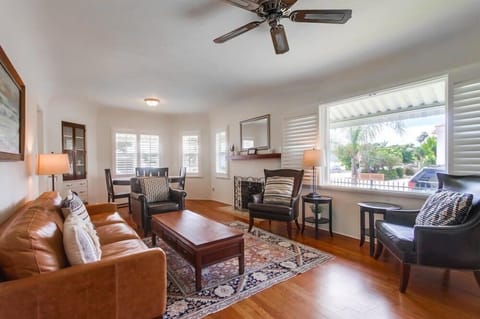 Spacious living room with plenty of window space to view the neighborhood