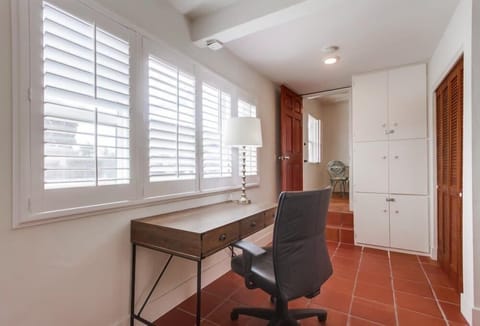 Desk with view of the drive way and patio