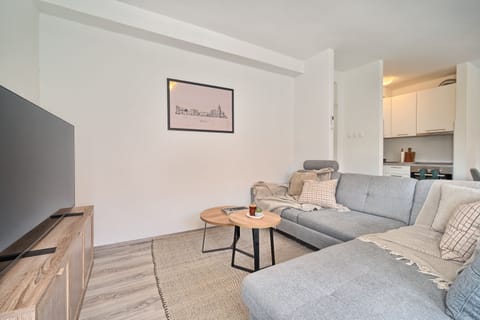 Living room has a big LED TV with cable channels