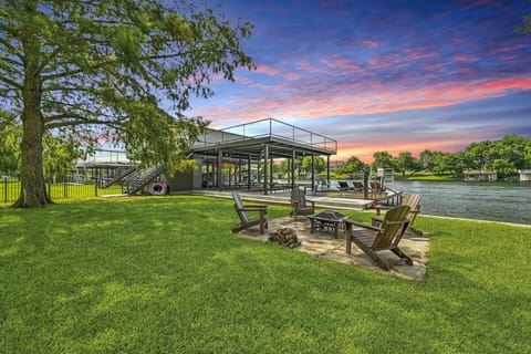 With gorgeous lake views from the deck, water access, grill, and a 2-slip boat dock + 2 space jet ski ramp, you'll never want to check-out!