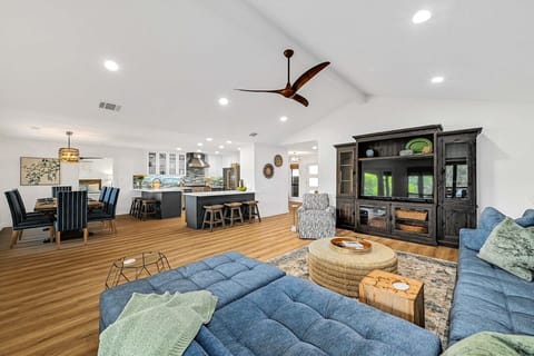 The open concept kitchen, living, and dining area is perfect for entertaining.