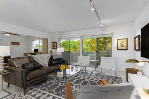 Living room shown with optional accordion wall open for maximum space