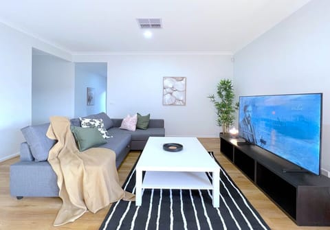 Living room with comfy sofa bed and smart TV