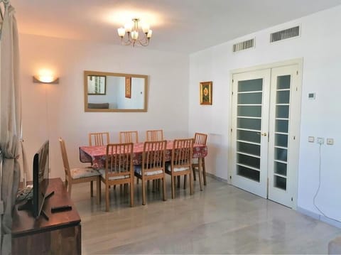 Another view of the lounge with dining area