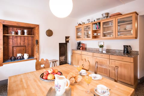 Kitchen with built-in furniture and dining table