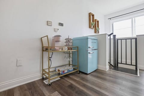 Upper level coffee bar and mini fridge