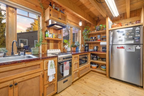 Efficiently spaced kitchen area with stainless appliances.
