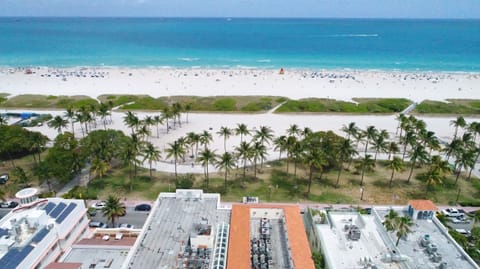 Aerial view over oceanfront CasaGrandeSouthBeach by AmericanVacationLiving on Ocean Drive in the heart of the Art Deco District with walking distance to Lincoln Road and South of Fifth's South Pointe Park. Walk, Jog or Bike around South Beach.
