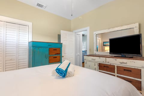 TV in the queen bedroom.