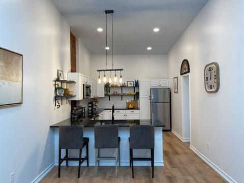 Open Concept full kitchen with granite counters and stainless steel appliances.