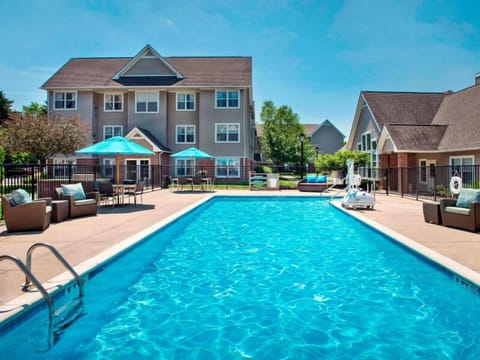 A heated pool, sun loungers