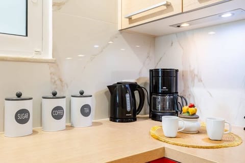 Fridge, oven, coffee/tea maker, toaster