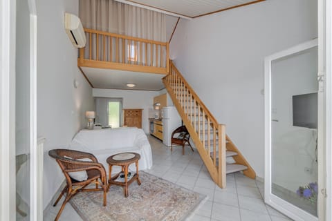 Living room: air-condition unit, LED TV with cable channels and  sofa bed