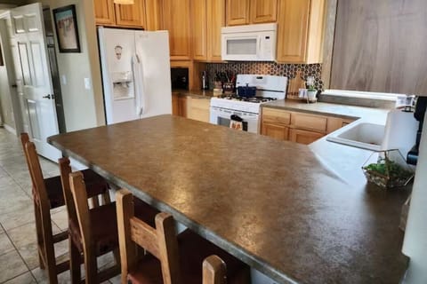 Additional seating at the kitchen bar.