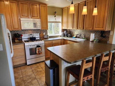 Open concept living, dining and kitchen stocked with everything you may need.  