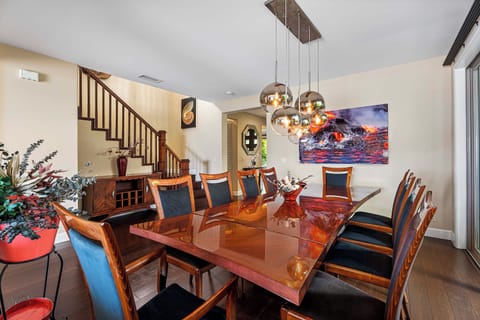 Formal dining area with custom artwork and statement lighting