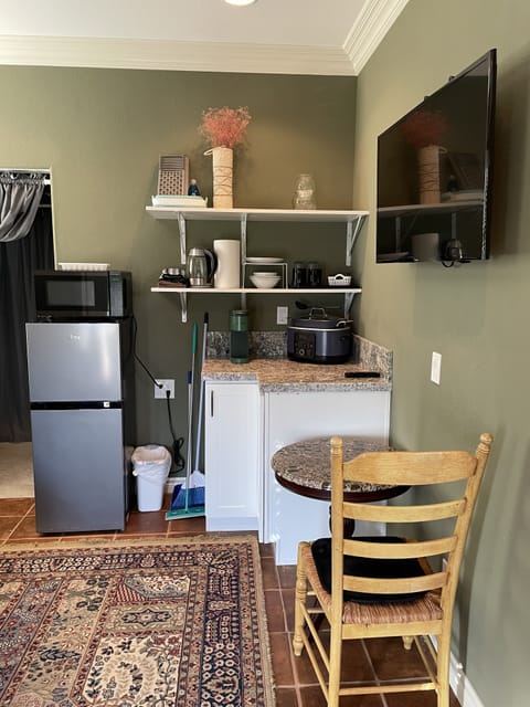 Fridge, microwave, coffee/tea maker, cookware/dishes/utensils