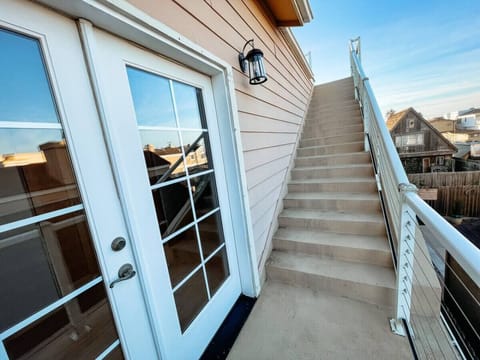 Outdoor stairs to rooftop deck.