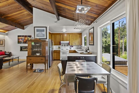 The breakfast table seats 4 people and is closest to the kitchen.