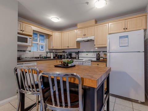 Breakfast station at the kitchen island, lots of counter space for food prep.
