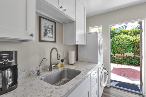 Kitchen: fully stocked with washer and dryer